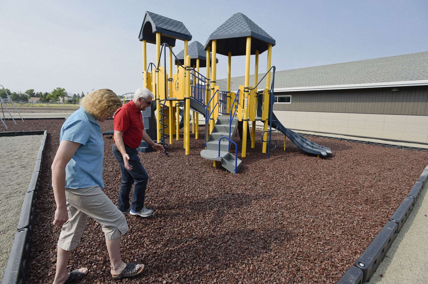School principal Jill Miller, left, and East Helena School District Superintendent Ron Whitmoyer take a walk through the playground (copy)